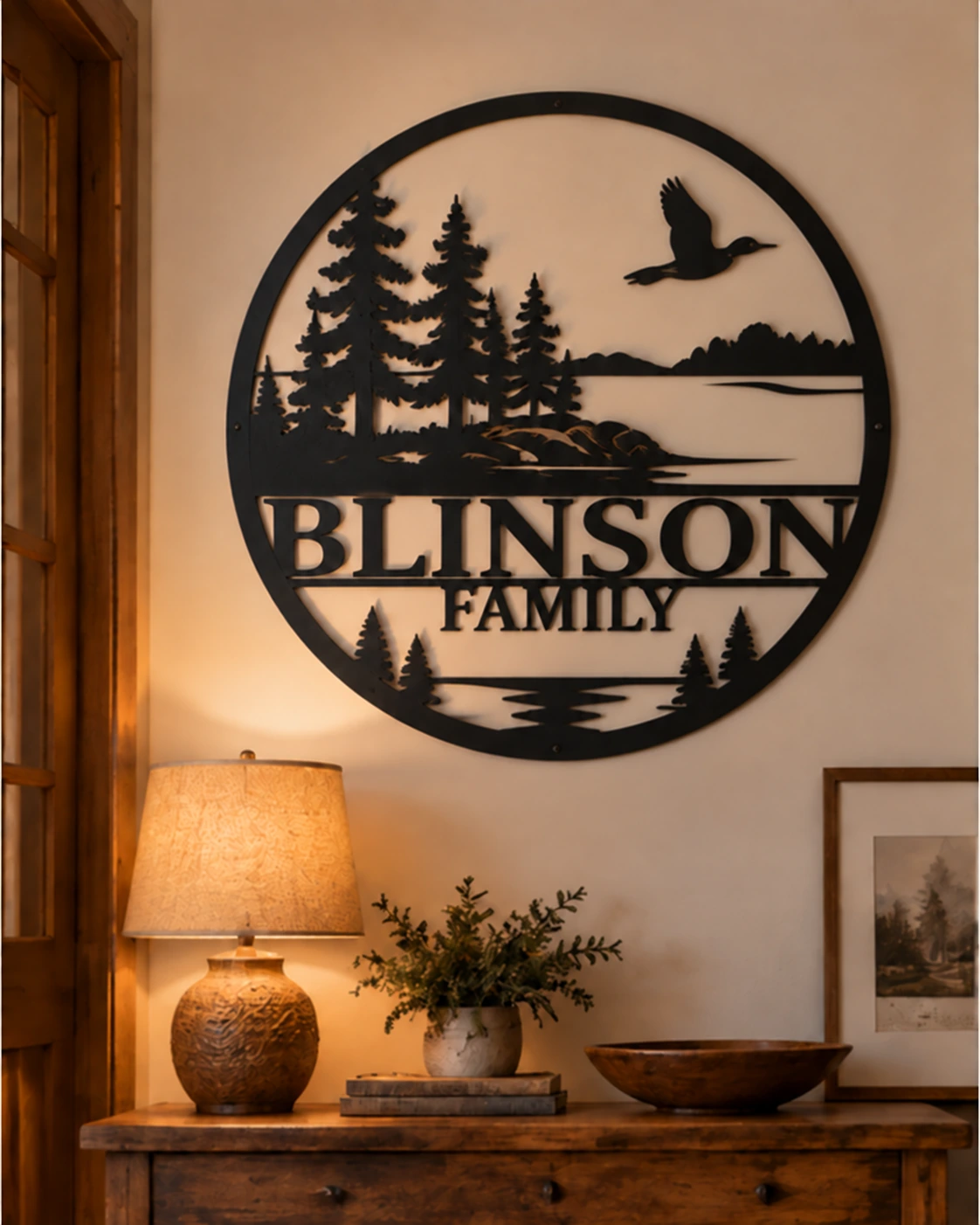 Blinson family loon and pine metal sign in a warm rustic entryway