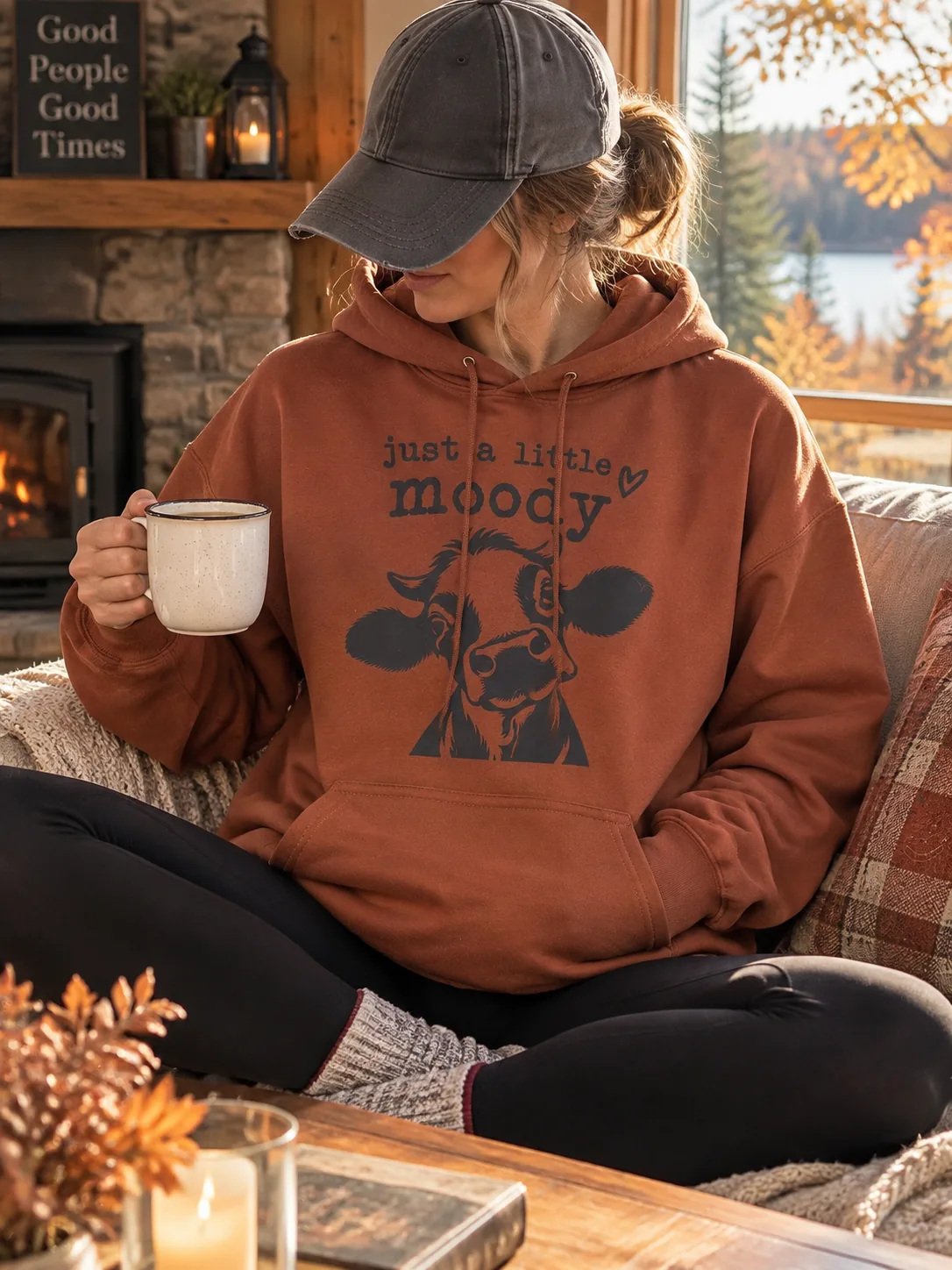 Just a Little Moody terracotta hoodie with cow graphic
